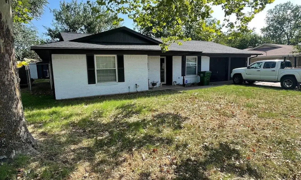 Professional roofing crew working on a residential roof in Blytheville